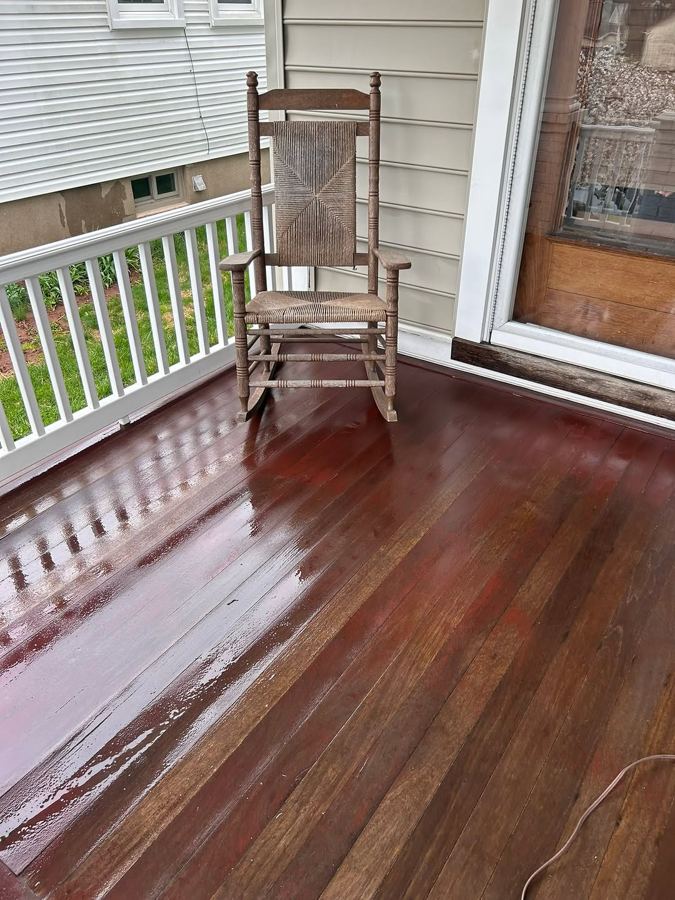 Porch deck rich and glossy after power washing