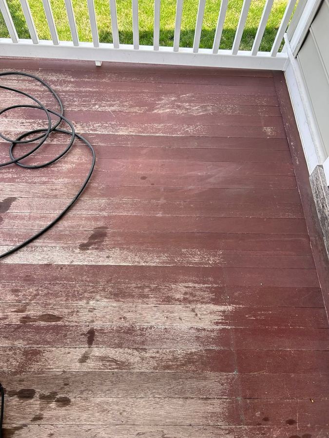 Same porch deck faded and dirty before power washing